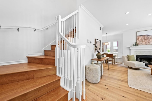 803 Jessie St, Austin, TX 78704 - staircase with wood finished floors, recessed lighting, and a fireplace