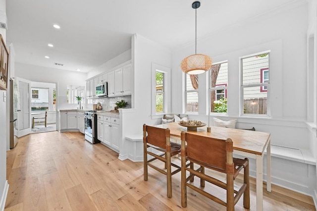 803 Jessie St, Austin, TX 78704 - dining space with plenty of natural light, recessed lighting, and light wood-style flooring