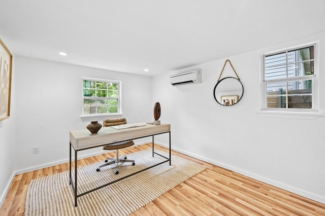 803 Jessie St, Austin, TX 78704 - home office featuring a wall unit AC, wood finished floors, and recessed lighting