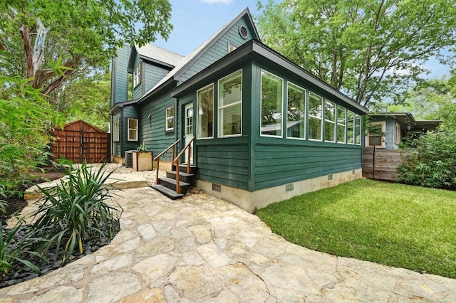 803 Jessie St, Austin, TX 78704 - view of front of property featuring crawl space, entry steps, and a patio