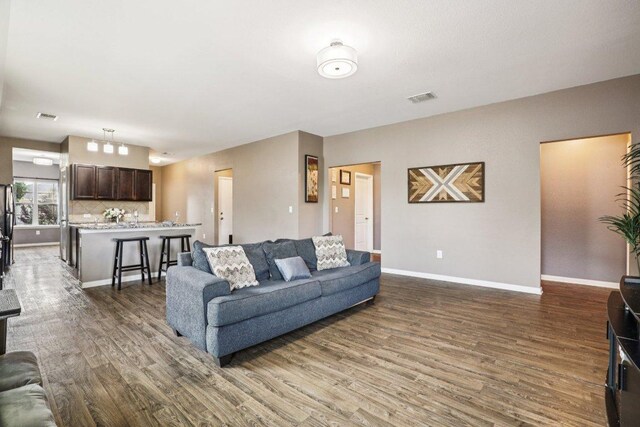 805 Red Tails Dr, Austin, TX 78725 - living area featuring wood finished floors