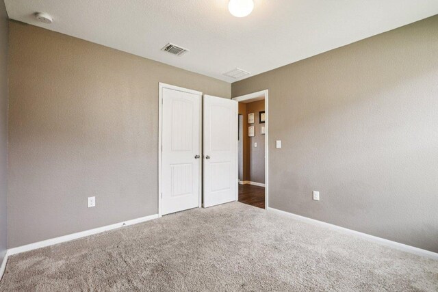 805 Red Tails Dr, Austin, TX 78725 - unfurnished bedroom featuring carpet floors and a closet