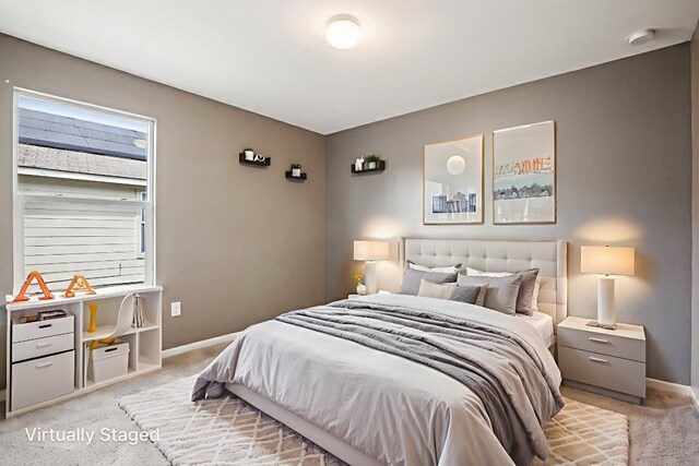 805 Red Tails Dr, Austin, TX 78725 - bedroom with light colored carpet and baseboards