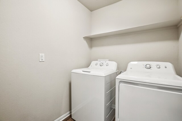805 Red Tails Dr, Austin, TX 78725 - laundry room with washer and dryer and baseboards