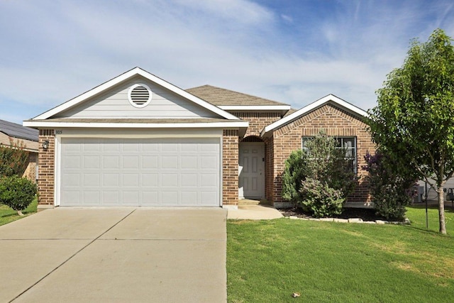 805 Red Tails Dr, Austin, TX 78725 - single story home with brick siding, driveway, a front lawn, and an attached garage