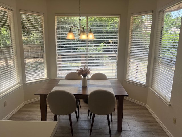 8104 Ephraim Rd, Austin, TX 78717 - dining room featuring a chandelier and wood finished floors