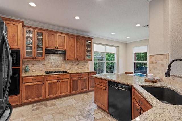 6906 Covered Bridge Dr, Austin, TX 78736 - kitchen featuring black appliances, brown cabinets, recessed lighting, crown molding, and tasteful backsplash