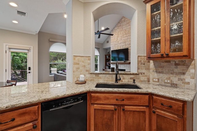 6906 Covered Bridge Dr, Austin, TX 78736 - kitchen featuring dishwasher, decorative backsplash, light stone countertops, ceiling fan, and glass insert cabinets