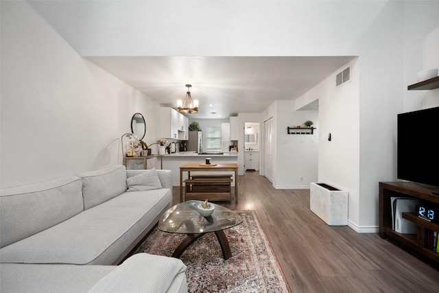 1135 Barton Hills Dr Unit 355, Austin, TX 78704 - living room with a chandelier and wood finished floors