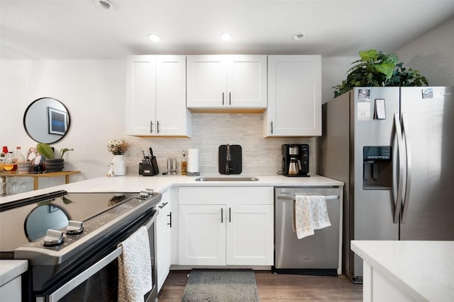 1135 Barton Hills Dr Unit 355, Austin, TX 78704 - kitchen with appliances with stainless steel finishes, light countertops, tasteful backsplash, and recessed lighting