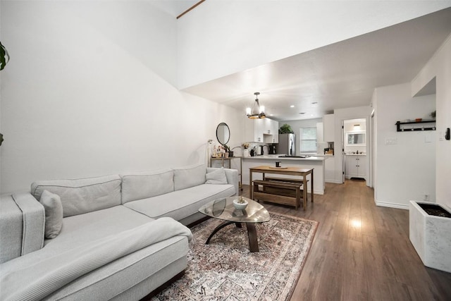1135 Barton Hills Dr Unit 355, Austin, TX 78704 - living room featuring a chandelier and wood finished floors