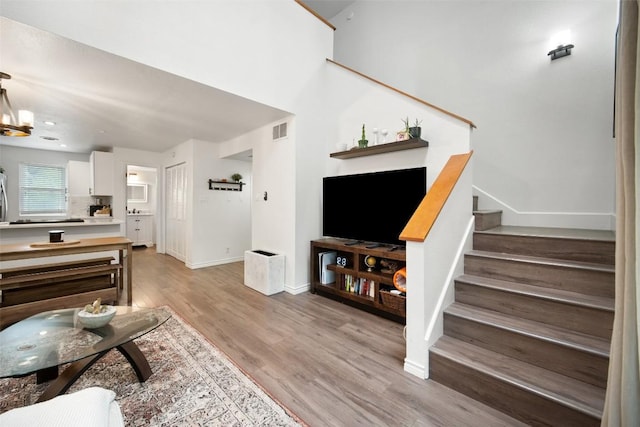 1135 Barton Hills Dr Unit 355, Austin, TX 78704 - living area featuring stairway and light wood-style flooring