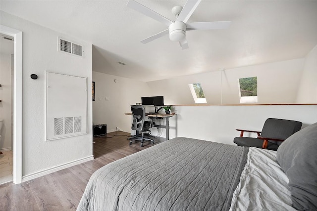 1135 Barton Hills Dr Unit 355, Austin, TX 78704 - bedroom with wood finished floors, a skylight, and a ceiling fan