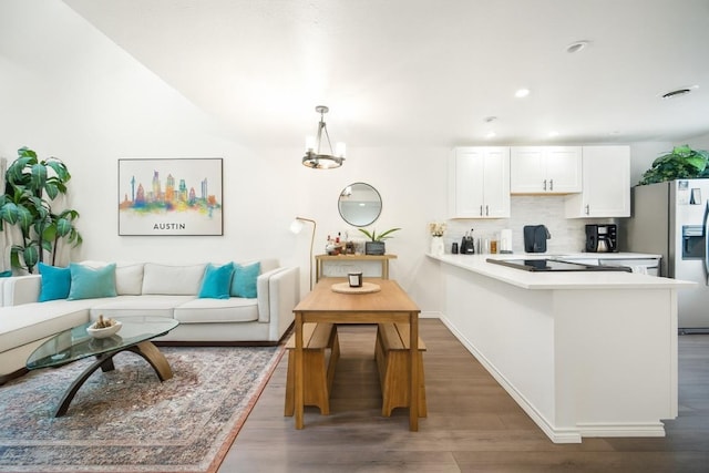 1135 Barton Hills Dr Unit 355, Austin, TX 78704 - living room featuring wood finished floors, a chandelier, and recessed lighting