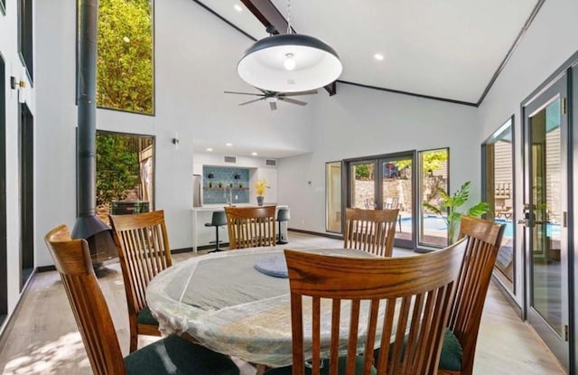 1135 Barton Hills Dr Unit 355, Austin, TX 78704 - dining area with french doors, high vaulted ceiling, ceiling fan, light wood finished floors, and recessed lighting