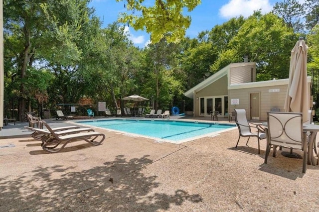 1135 Barton Hills Dr Unit 355, Austin, TX 78704 - community pool with a patio and view of scattered trees