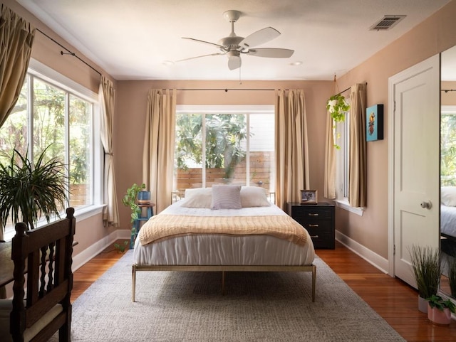 1005 E Riverside Dr, Austin, TX 78704 - bedroom with wood finished floors and a ceiling fan