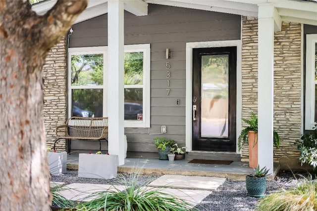5317 Westminster Dr, Austin, TX 78723 - property entrance with a porch and stone siding