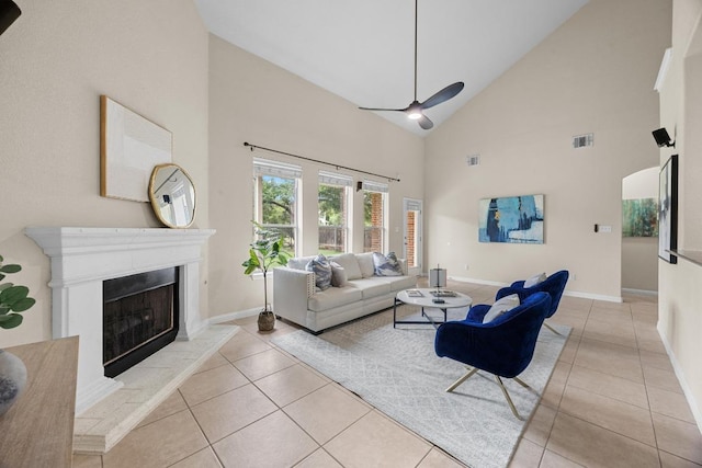 4009 Wilderness Path Bnd, Cedar Park, TX 78613 - living room featuring high vaulted ceiling, tile patterned flooring, a fireplace with raised hearth, and a ceiling fan