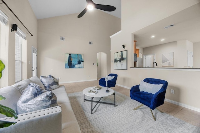 4009 Wilderness Path Bnd, Cedar Park, TX 78613 - living room featuring a ceiling fan, arched walkways, tile patterned flooring, and high vaulted ceiling