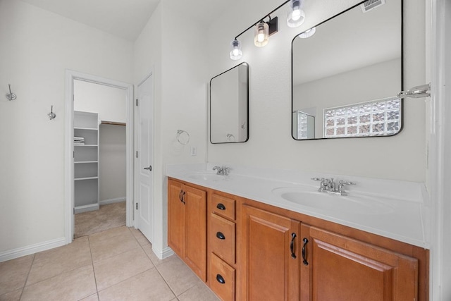 4009 Wilderness Path Bnd, Cedar Park, TX 78613 - bathroom with double vanity, tile patterned floors, and a spacious closet