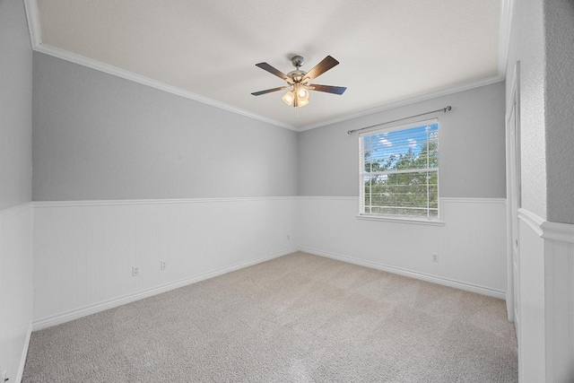 4009 Wilderness Path Bnd, Cedar Park, TX 78613 - empty room featuring a ceiling fan, carpet, a wainscoted wall, and ornamental molding