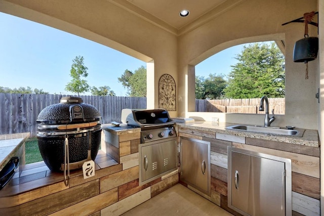 509 Fair Oaks Dr, Georgetown, TX 78628 - fenced backyard with an outdoor kitchen