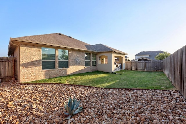 509 Fair Oaks Dr, Georgetown, TX 78628 - rear view of property featuring brick siding and a fenced backyard