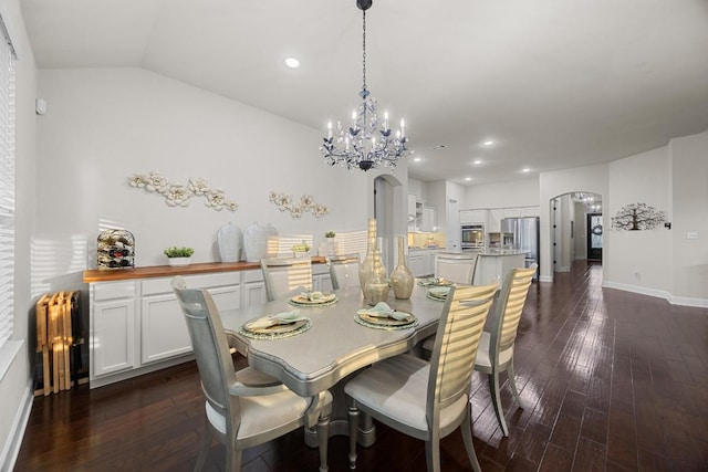 509 Fair Oaks Dr, Georgetown, TX 78628 - dining room with arched walkways, dark wood-style flooring, a chandelier, recessed lighting, and vaulted ceiling