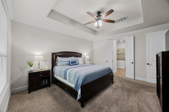 509 Fair Oaks Dr, Georgetown, TX 78628 - carpeted bedroom with a raised ceiling, crown molding, and a ceiling fan