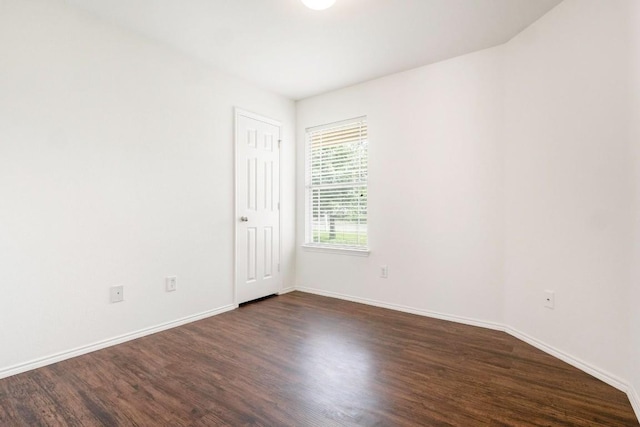 109 Onyx Lake Dr, Kyle, TX 78640 - empty room with dark wood-style floors and baseboards