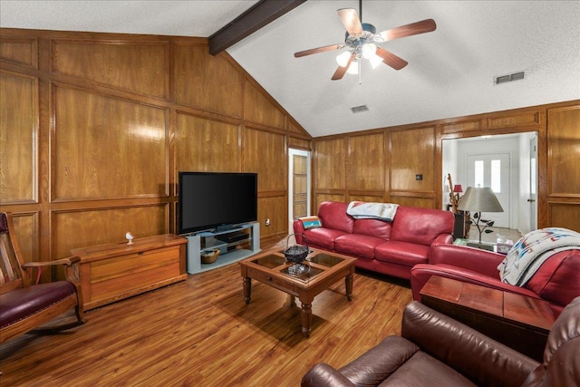 1601 Samoa Ct, Pflugerville, TX 78660 - living area with wood finished floors, wooden walls, and a ceiling fan