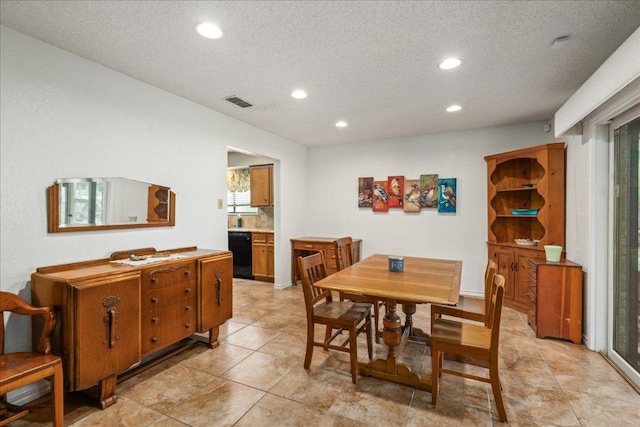1601 Samoa Ct, Pflugerville, TX 78660 - dining space featuring recessed lighting, a textured ceiling, and light tile patterned floors