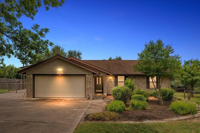 1601 Samoa Ct, Pflugerville, TX 78660 - view of front of house with driveway, brick siding, and an attached garage