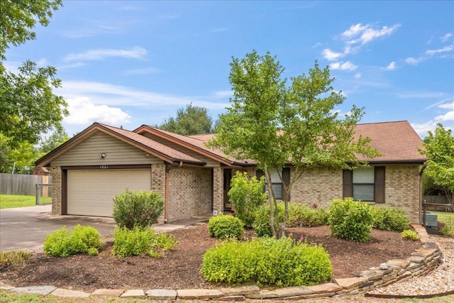 1601 Samoa Ct, Pflugerville, TX 78660 - ranch-style house with brick siding, asphalt driveway, and an attached garage