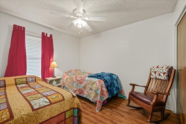 1601 Samoa Ct, Pflugerville, TX 78660 - bedroom with wood finished floors, a textured ceiling, and ceiling fan