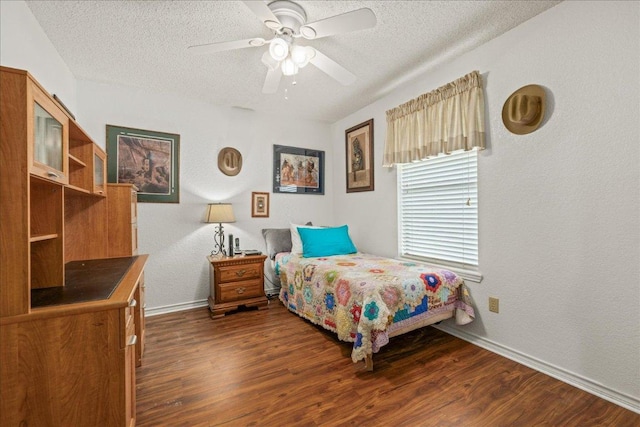 1601 Samoa Ct, Pflugerville, TX 78660 - bedroom with a textured ceiling, dark wood finished floors, ceiling fan, and a textured wall