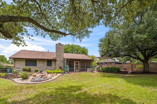 1601 Samoa Ct, Pflugerville, TX 78660 - rear view of house with a sunroom and a chimney