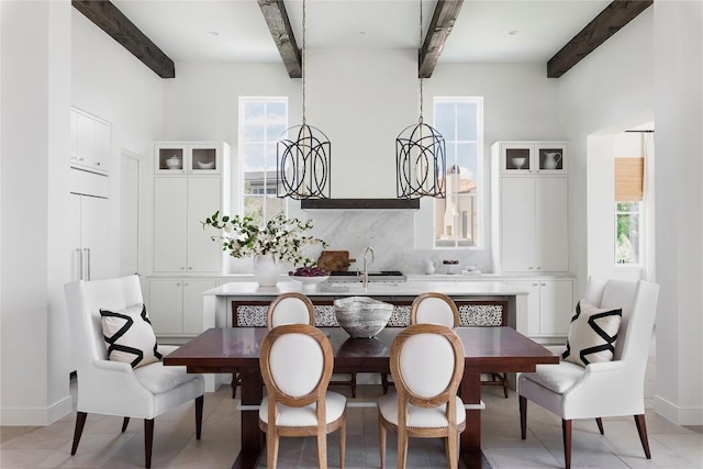 4401 Amarra Dr Unit 19, Austin, TX 78735 - dining area with beam ceiling and healthy amount of natural light