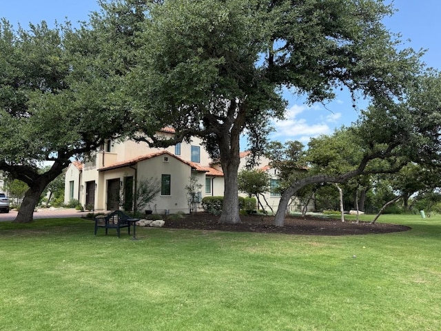 4401 Amarra Dr Unit 19, Austin, TX 78735 - view of green lawn featuring an attached garage