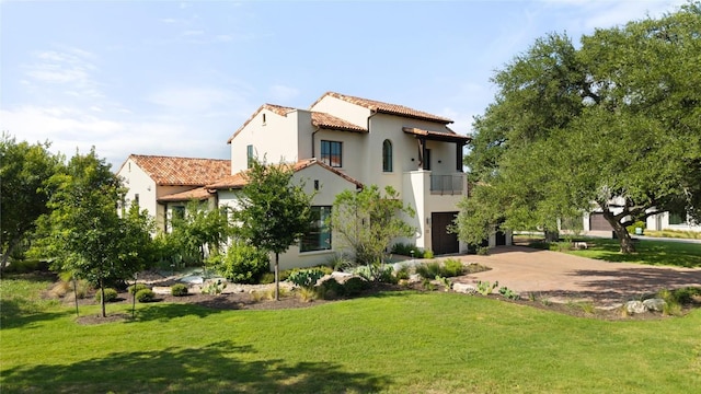 4401 Amarra Dr Unit 19, Austin, TX 78735 - rear view of property with a balcony, concrete driveway, a tiled roof, a yard, and a garage