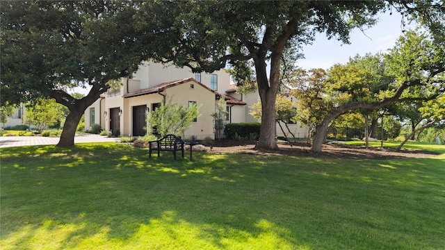 4401 Amarra Dr Unit 19, Austin, TX 78735 - view of home's exterior featuring a lawn and stucco siding