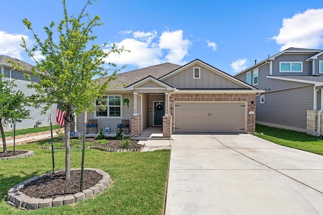 112 Wichita River Rd, Hutto, TX 78634 - craftsman-style house with a garage, brick siding, board and batten siding, concrete driveway, and a front lawn