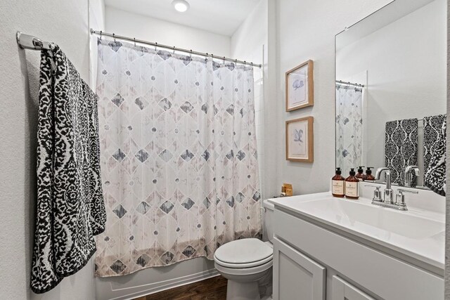 112 Wichita River Rd, Hutto, TX 78634 - bathroom featuring vanity, wood finished floors, and shower / tub combo