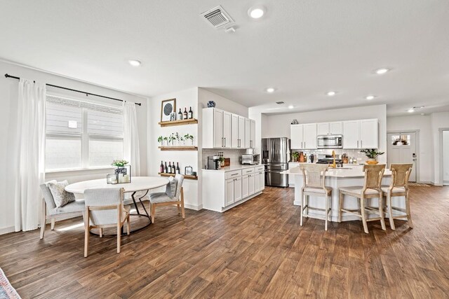 112 Wichita River Rd, Hutto, TX 78634 - dining space featuring dark wood-style floors and recessed lighting