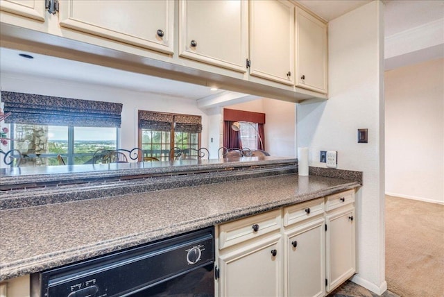501 Highlands Blvd Unit 13, Horseshoe Bay, TX 78657 - kitchen featuring carpet, black dishwasher, and dark countertops