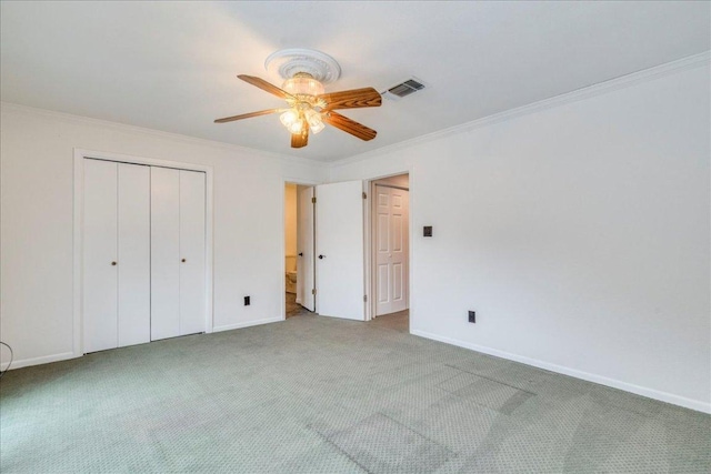 501 Highlands Blvd Unit 13, Horseshoe Bay, TX 78657 - unfurnished bedroom with carpet floors, crown molding, a closet, and ceiling fan
