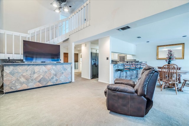 501 Highlands Blvd Unit 13, Horseshoe Bay, TX 78657 - living room featuring carpet floors and a ceiling fan