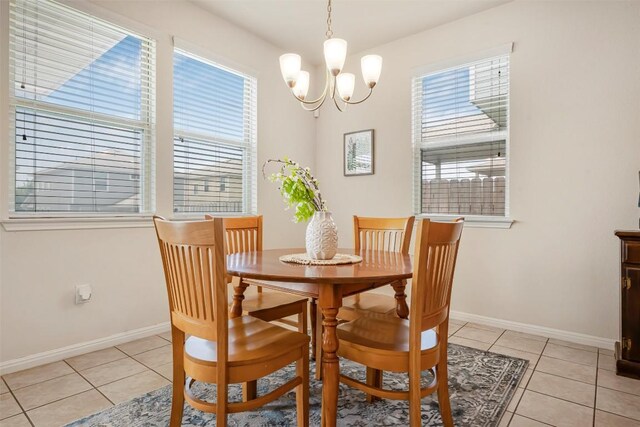 221 Pearl Way, Buda, TX 78610 - dining space featuring a chandelier and light tile patterned floors