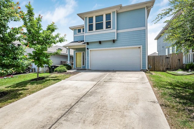 221 Pearl Way, Buda, TX 78610 - traditional home featuring an attached garage and concrete driveway